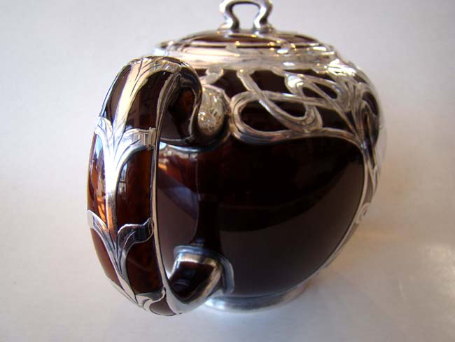 An absolutely stunning scarlet red ceramic teapot with unbelievable silver overlay circa 1890 — image 3